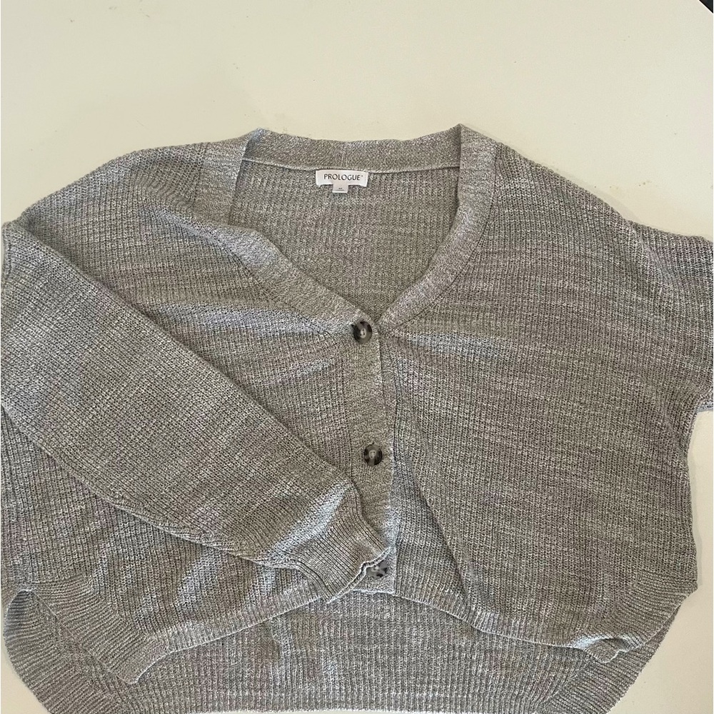 grey sweater with black and white buttons from prologue
